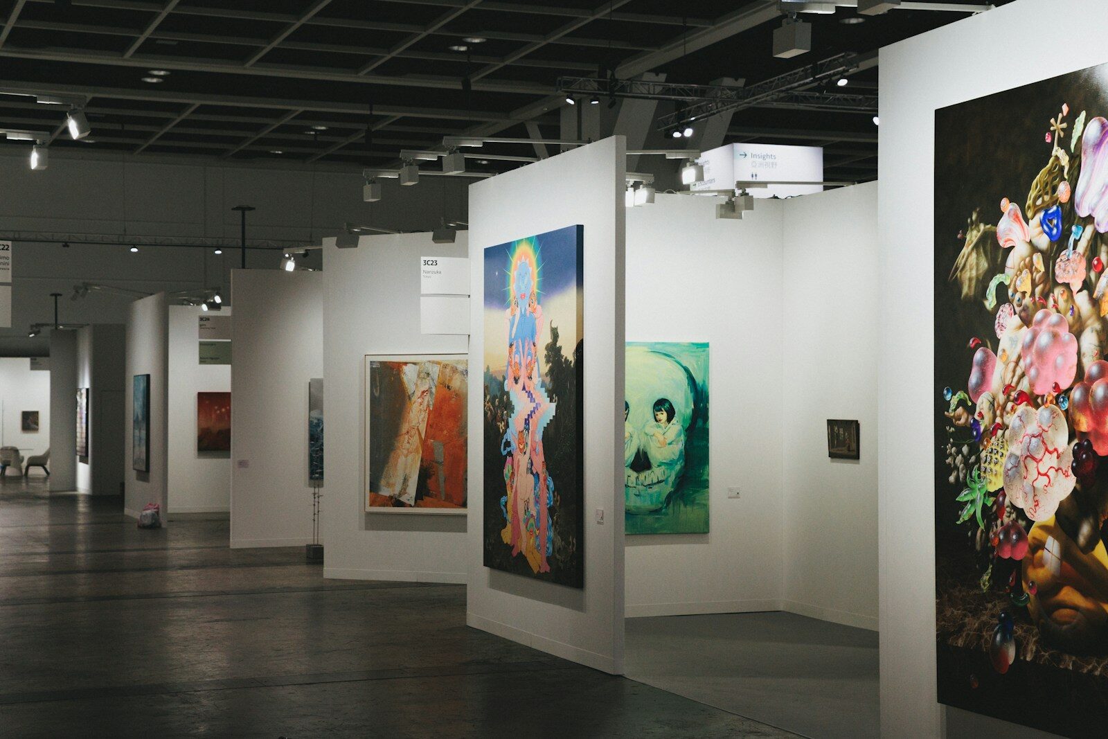 Gallery owner reviewing artwork reserve prices
