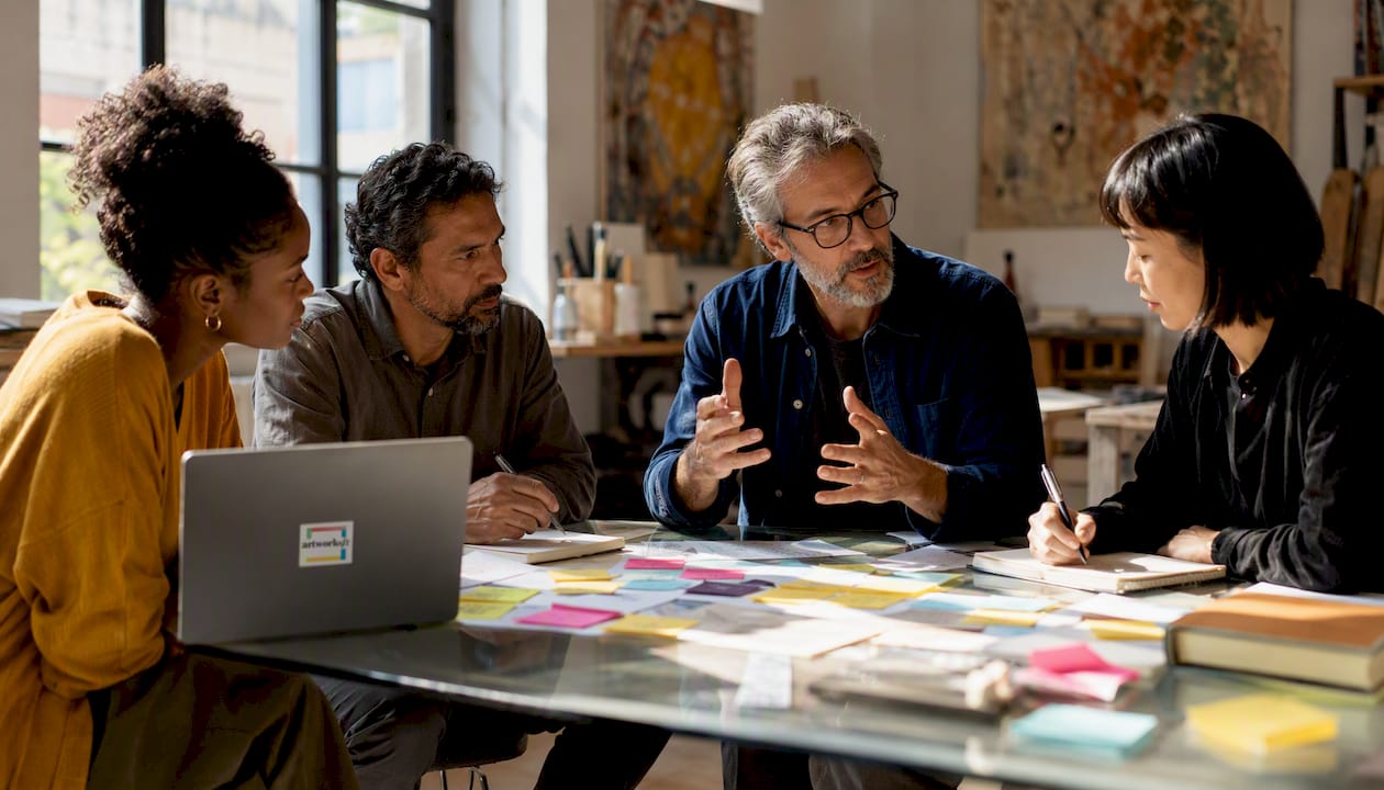 Curatorial team planning exhibition layout