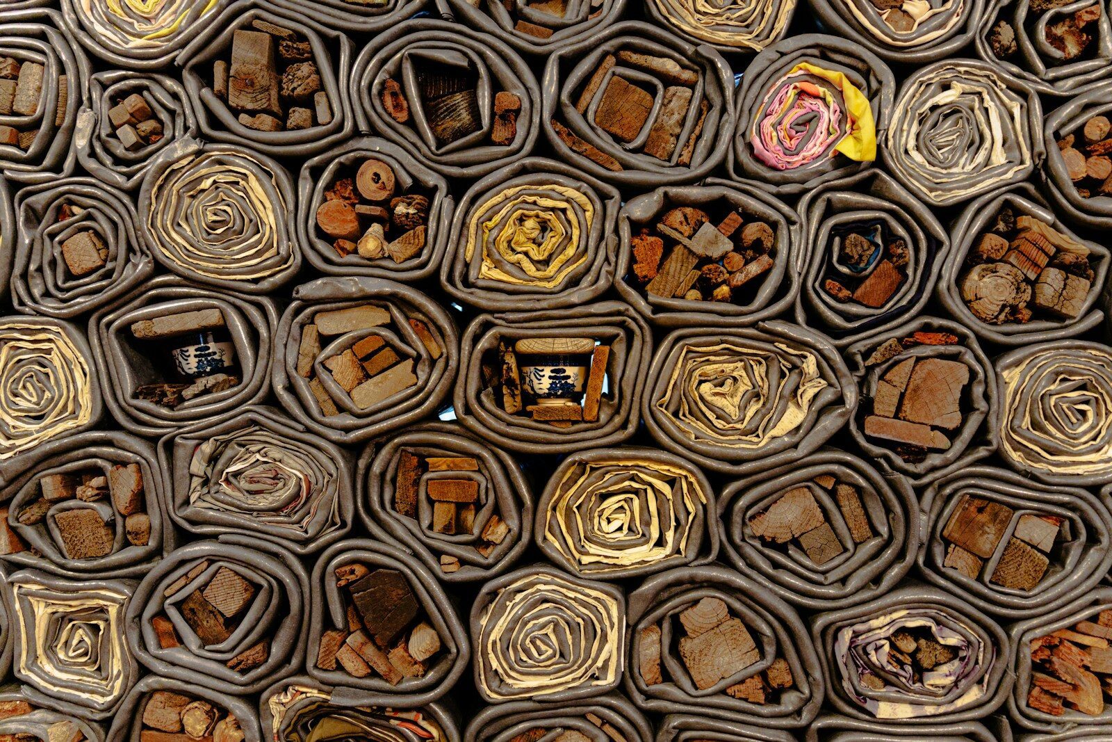 Close-up of a bee hotel with various materials