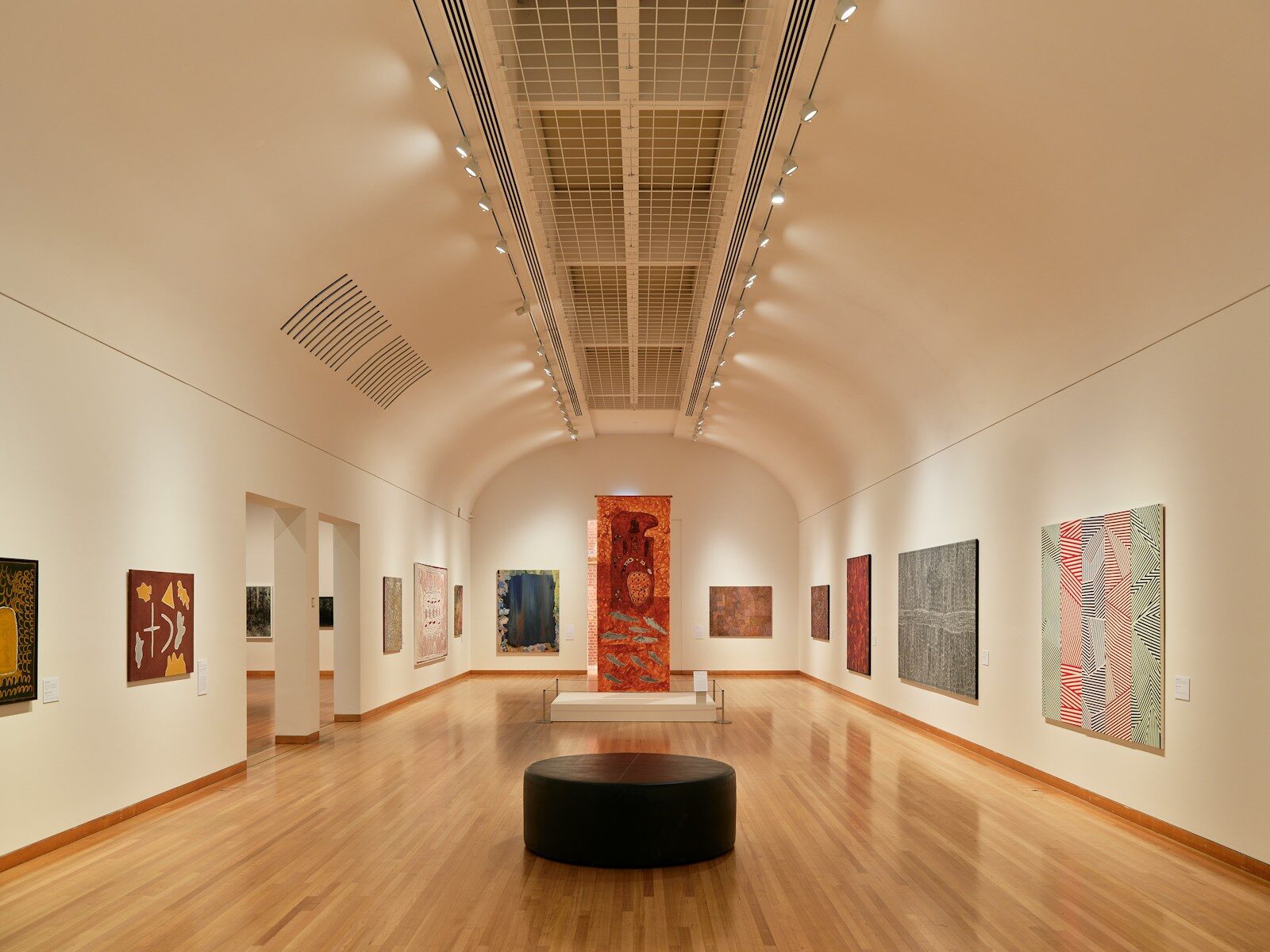 A room with a lot of paintings on the walls