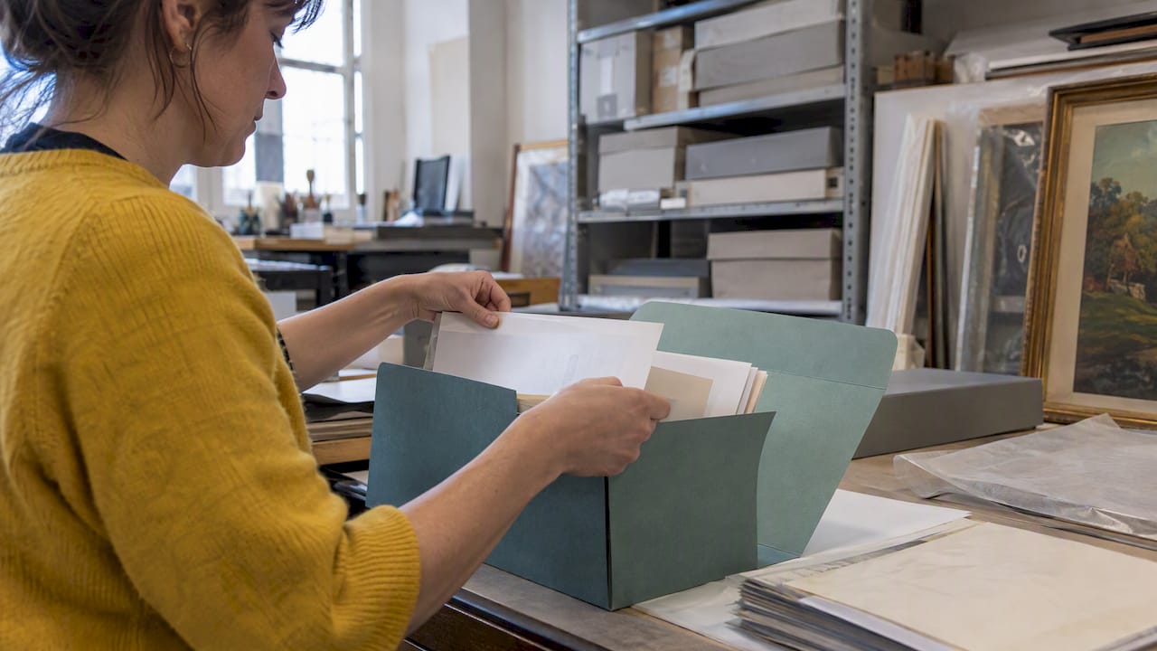 Gallery provenance papers sorted into archival folder
